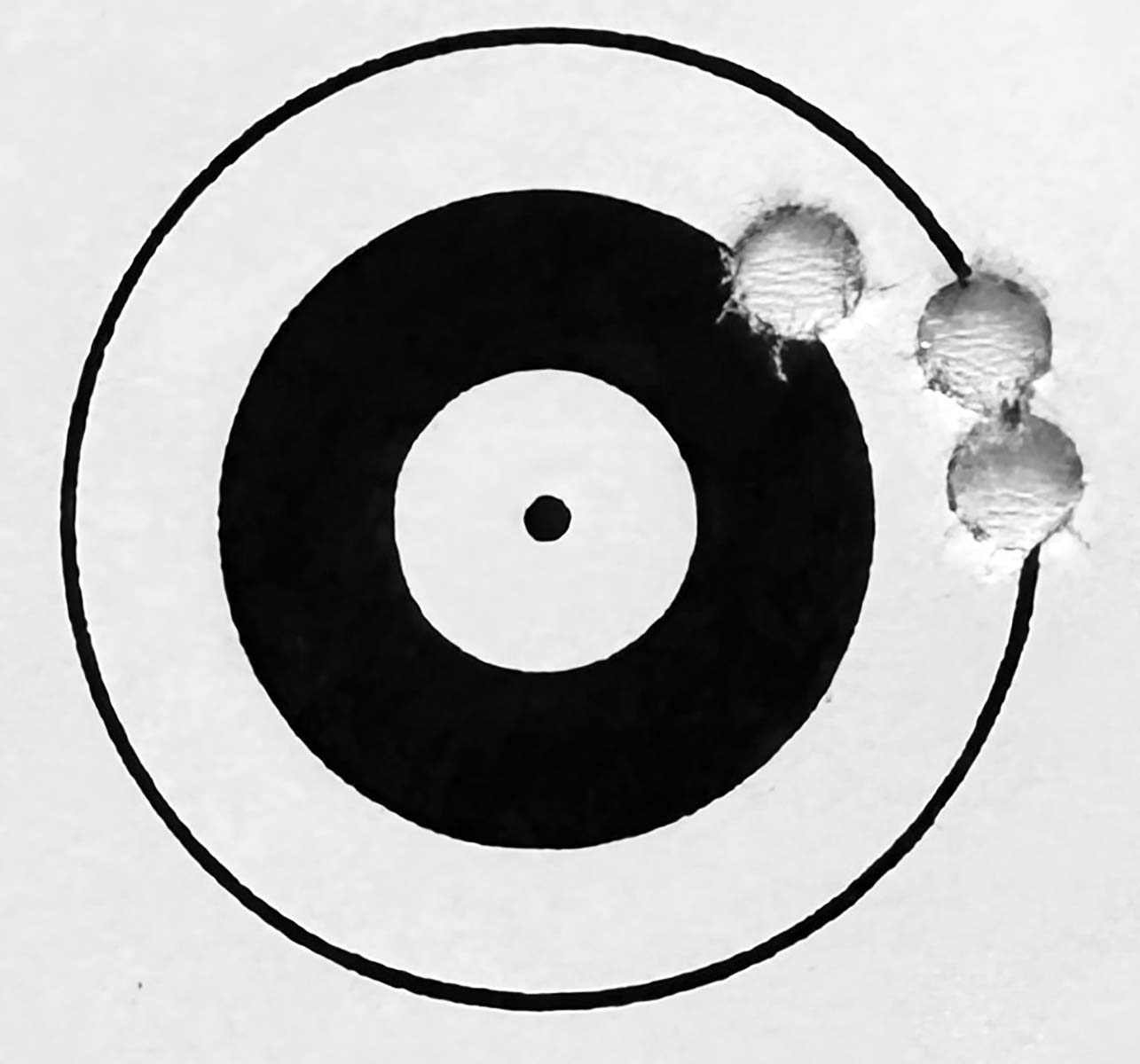 Extended distance groups highlight flaws or confirm earlier tuning decisions. This three-shot 200-yard group confirmed the load for a level two Rock River 223. The 55-grain NoslerVarmageddon bullet is held in place by .003 inches of neck tension, propelled by 23.0 grains of AR-Comp powder, ignited by Wolf primers.
